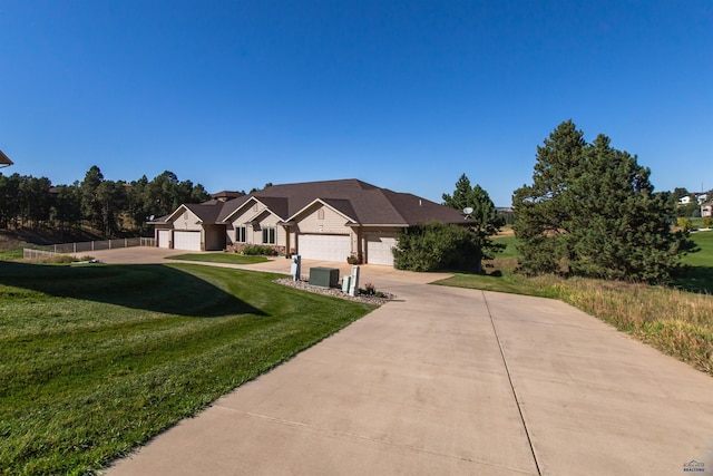 view of front of home with a garage and a front yard