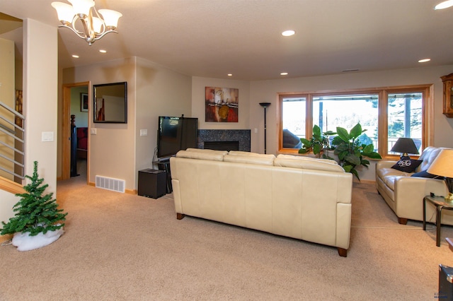 living room featuring a notable chandelier and light colored carpet