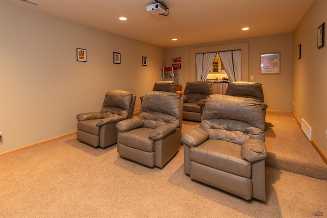 home theater room featuring light carpet