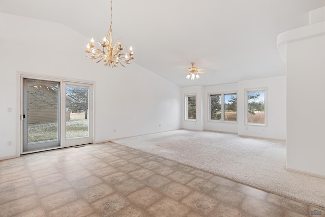 empty room with light carpet, ceiling fan with notable chandelier, lofted ceiling, and a wealth of natural light