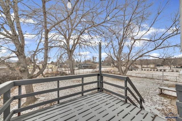 view of snow covered deck