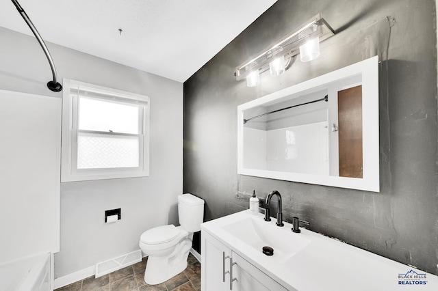 bathroom featuring toilet and vanity