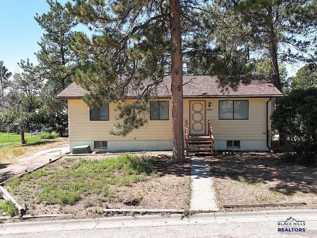 view of front of home with cooling unit