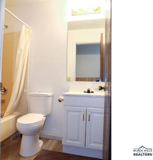 full bathroom with vanity, toilet, shower / bath combination with curtain, and hardwood / wood-style floors