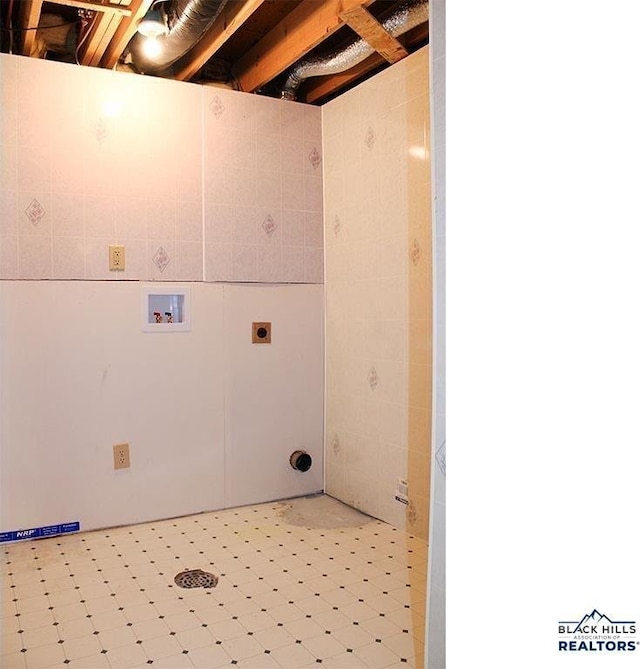 clothes washing area featuring hookup for a washing machine and hookup for an electric dryer