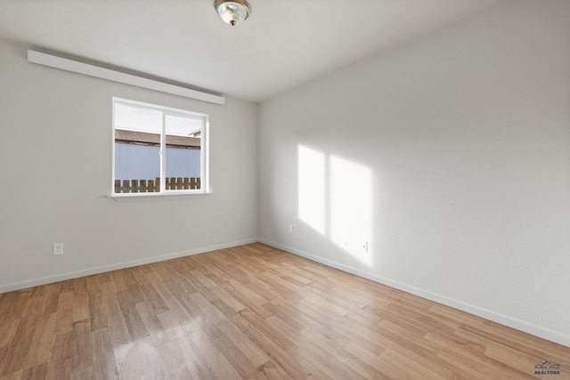 unfurnished room featuring light wood-type flooring