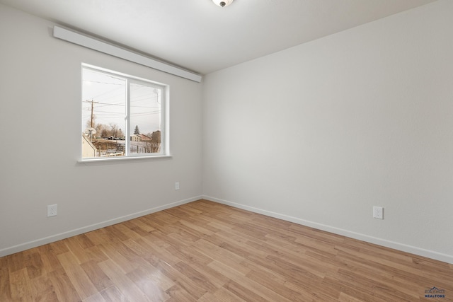 unfurnished room featuring light hardwood / wood-style floors