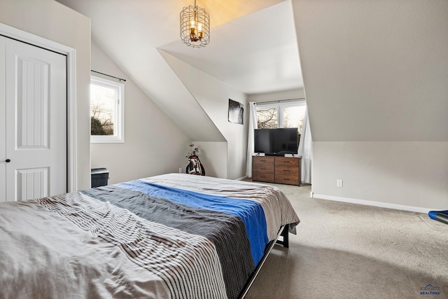 bedroom featuring carpet and lofted ceiling