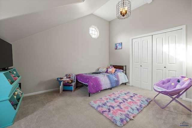 carpeted bedroom featuring a closet and vaulted ceiling