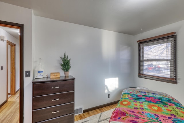 bedroom featuring light wood-type flooring