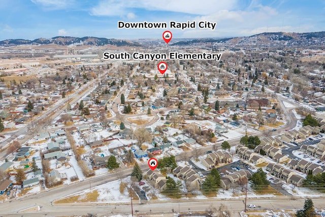 birds eye view of property with a mountain view