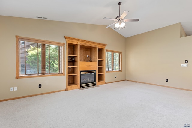 unfurnished living room with lofted ceiling, carpet floors, and ceiling fan