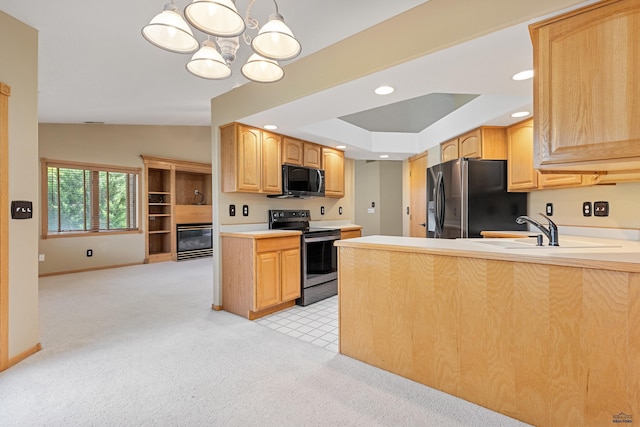 kitchen featuring hanging light fixtures, refrigerator with ice dispenser, light brown cabinetry, and stainless steel electric range