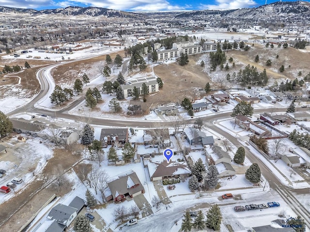 snowy aerial view with a mountain view