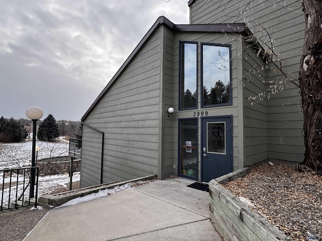 view of snow covered property entrance