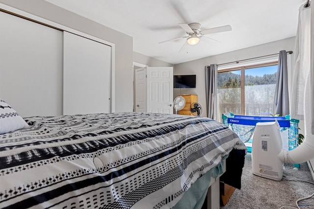 bedroom with a closet, ceiling fan, and carpet