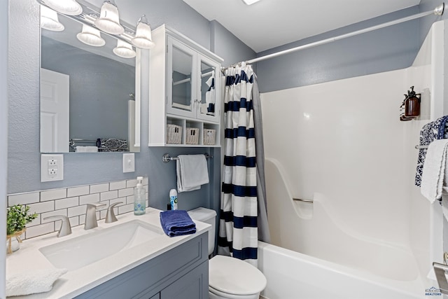 full bathroom featuring tasteful backsplash, vanity, toilet, and shower / bathtub combination with curtain