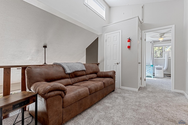 living room featuring high vaulted ceiling and light carpet