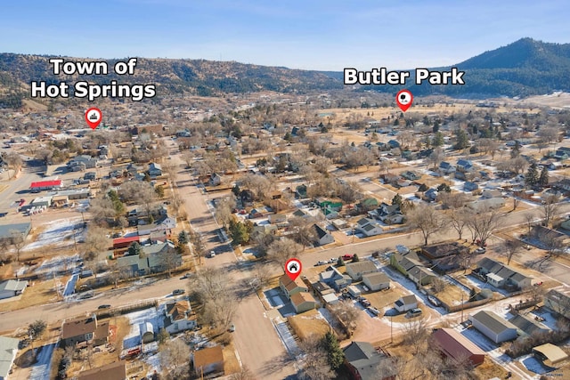 birds eye view of property with a mountain view