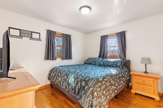 bedroom featuring wood-type flooring