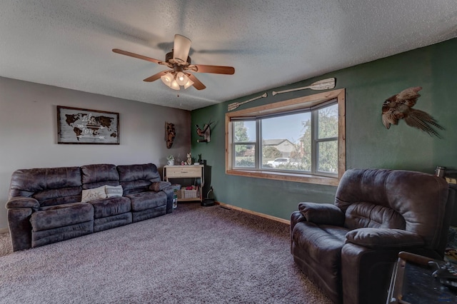 living room with ceiling fan, carpet floors, and a textured ceiling