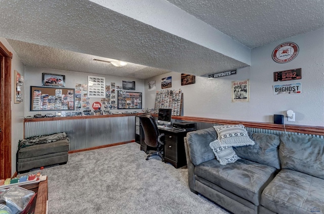 office with a textured ceiling and carpet flooring