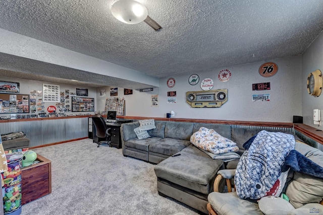 carpeted living room featuring a textured ceiling