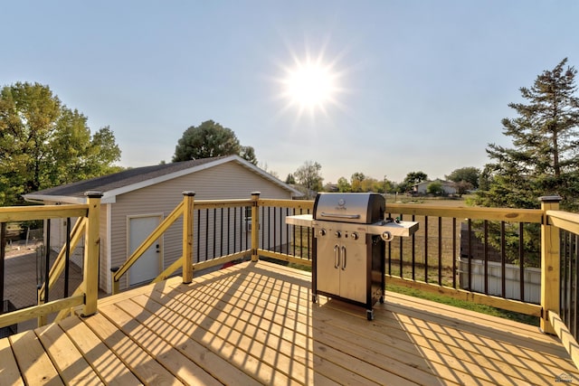 wooden terrace with area for grilling