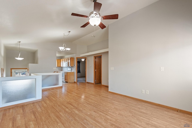 unfurnished living room with vaulted ceiling, light hardwood / wood-style floors, and ceiling fan