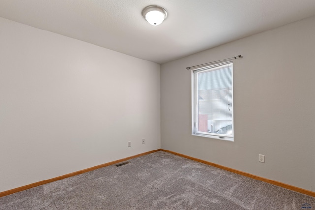 spare room with carpet flooring