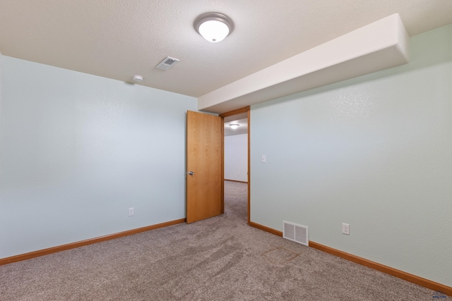 empty room featuring carpet flooring