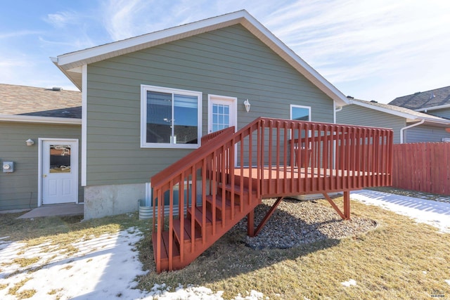 back of house featuring a wooden deck