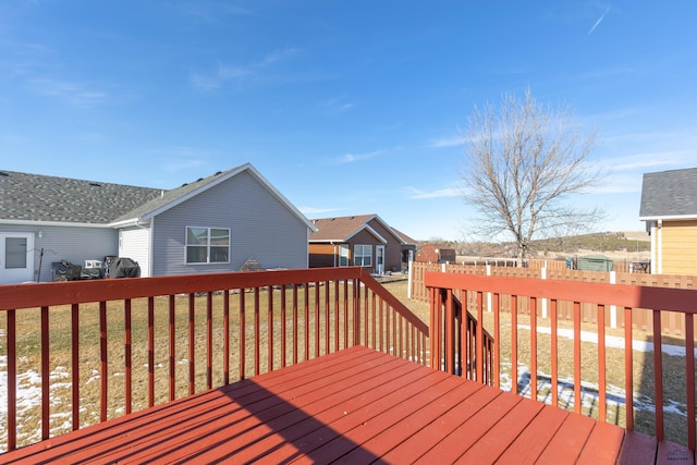 wooden terrace with a yard