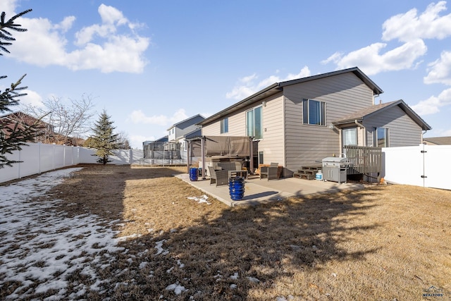 back of property with a patio area