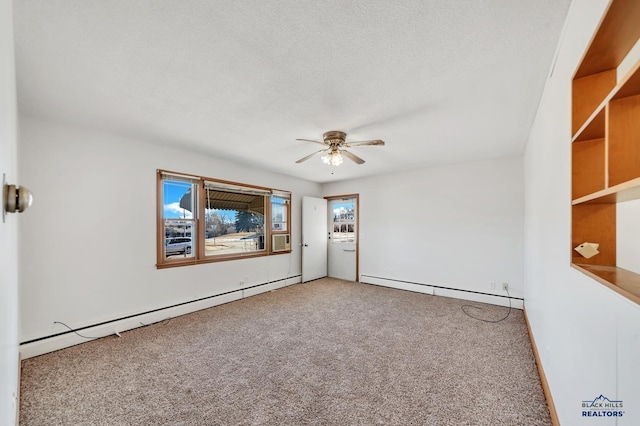 carpeted empty room with plenty of natural light, ceiling fan, and baseboard heating