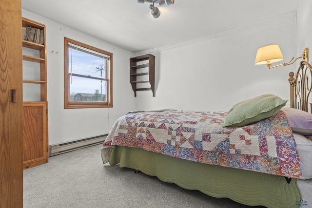 318 4th Ave, Wall, SD 57790 - carpeted bedroom with a baseboard radiator