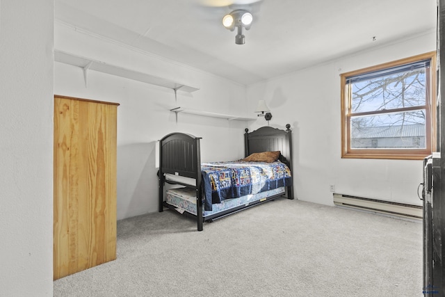 318 4th Ave, Wall, SD 57790 - carpeted bedroom with a baseboard heating unit