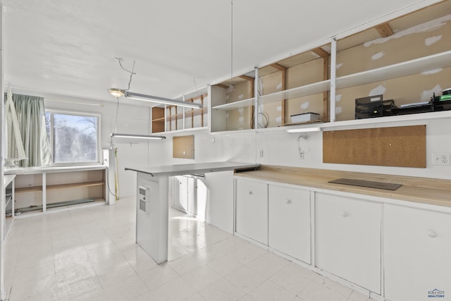 318 4th Ave, Wall, SD 57790 - kitchen featuring white cabinets