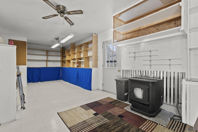 318 4th Ave, Wall, SD 57790 - interior space featuring ceiling fan and a wood stove