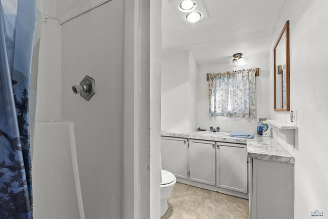 318 4th Ave, Wall, SD 57790 - bathroom featuring vanity, a shower, and toilet