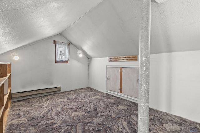 318 4th Ave, Wall, SD 57790 - bonus room featuring vaulted ceiling, carpet flooring, a textured ceiling, and baseboard heating