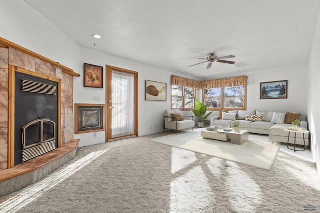 318 4th Ave, Wall, SD 57790 - carpeted living room featuring ceiling fan and a high end fireplace