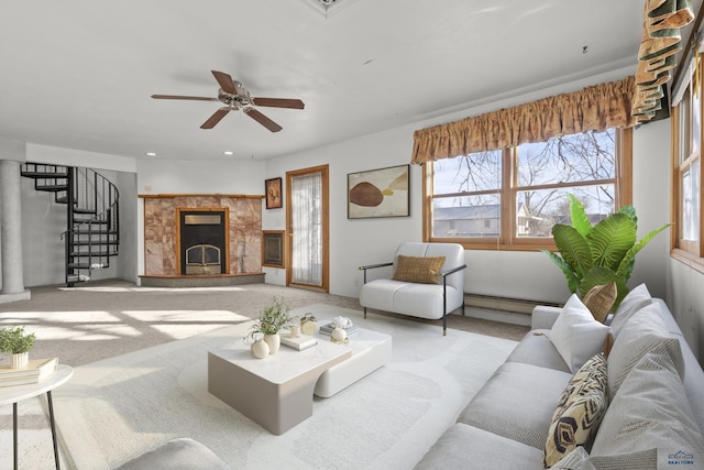 318 4th Ave, Wall, SD 57790 - carpeted living room featuring a baseboard heating unit and ceiling fan