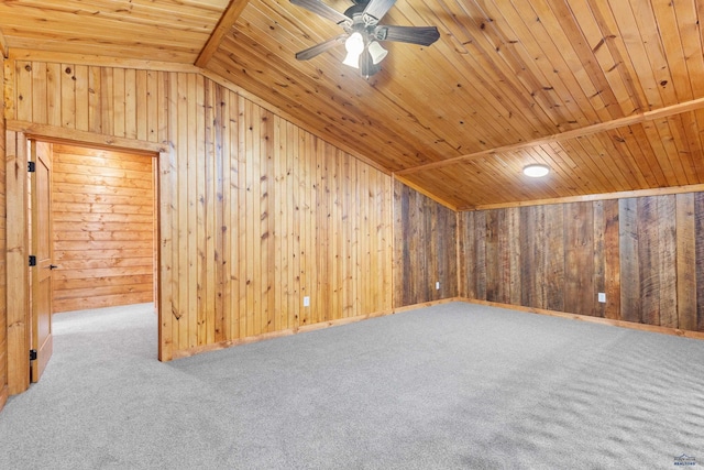 additional living space featuring vaulted ceiling, carpet, wooden ceiling, and wooden walls