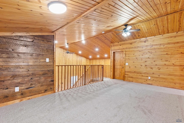 bonus room with vaulted ceiling, wood walls, carpet flooring, ceiling fan, and wood ceiling