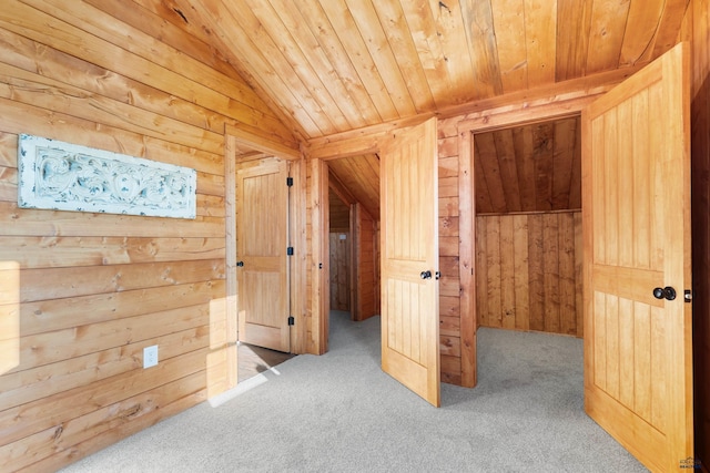 unfurnished bedroom with wood ceiling, lofted ceiling, wooden walls, and carpet floors