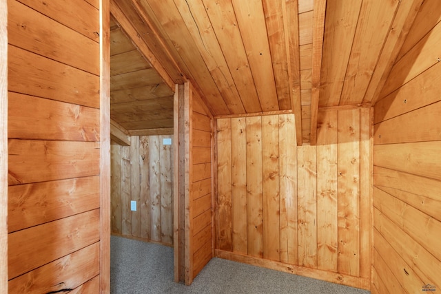 additional living space with wooden walls, vaulted ceiling, carpet, and wooden ceiling