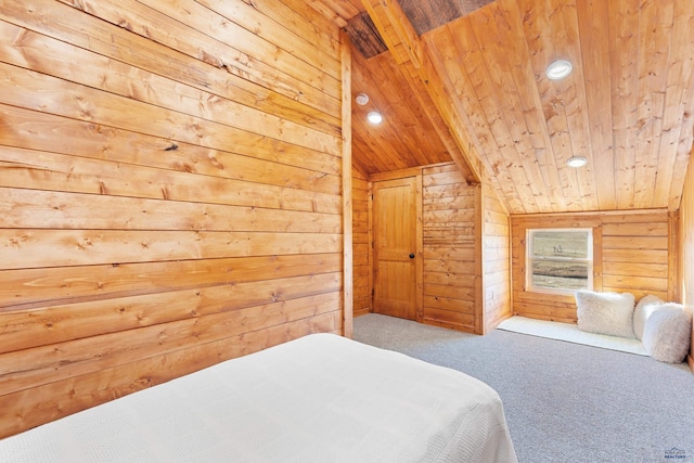 bedroom with vaulted ceiling, carpet, wooden walls, and wood ceiling