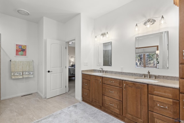 bathroom with vanity and tile patterned flooring