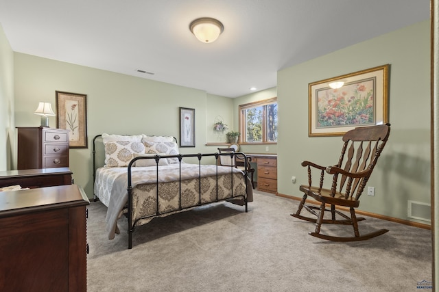 bedroom featuring light colored carpet